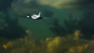 plane flying near storm